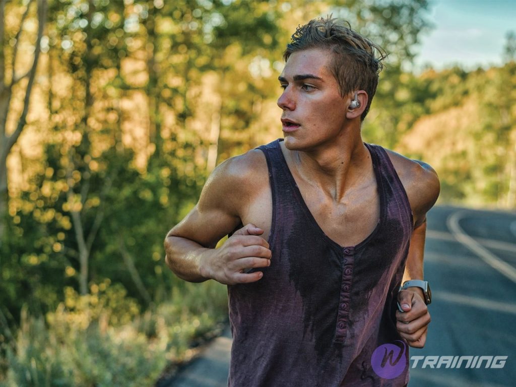 a man runs with true wireless earbuds for running