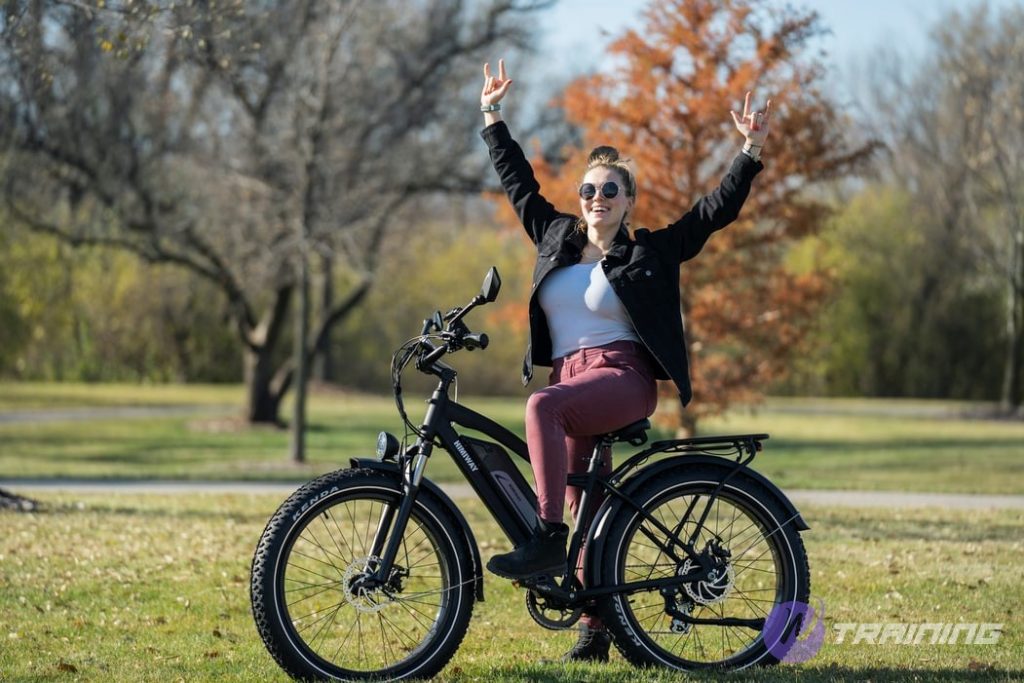 a happy girl prepares to ride a bike
