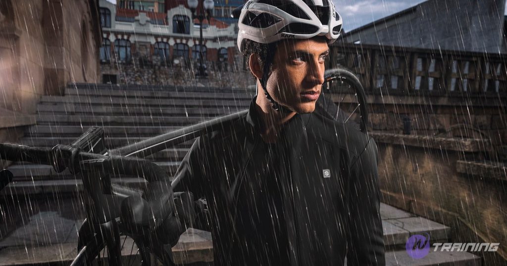 a man is bringing his bicycle in the rain