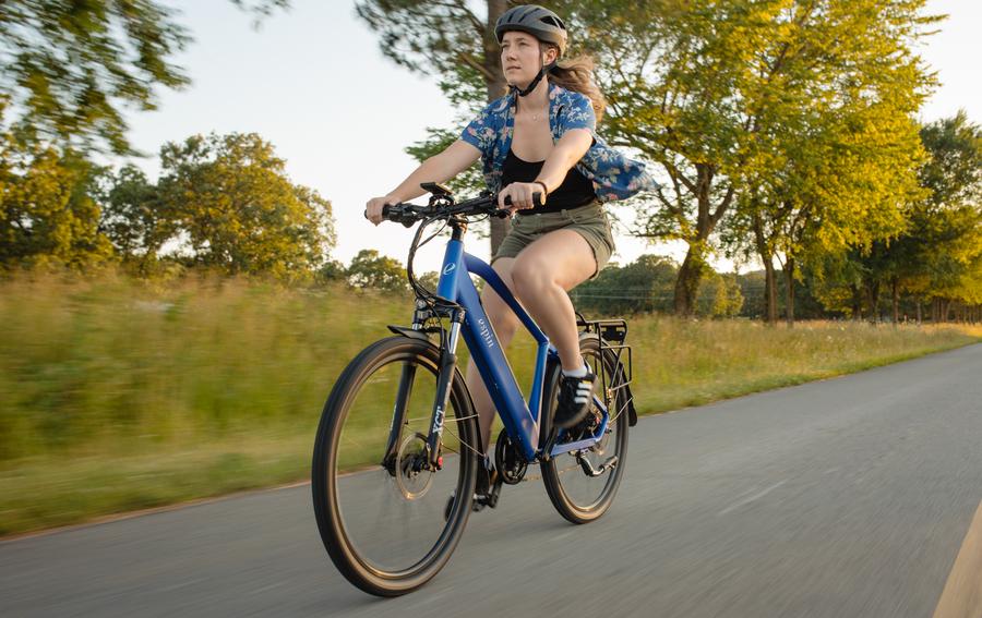 a woman rides Espin e-bikes