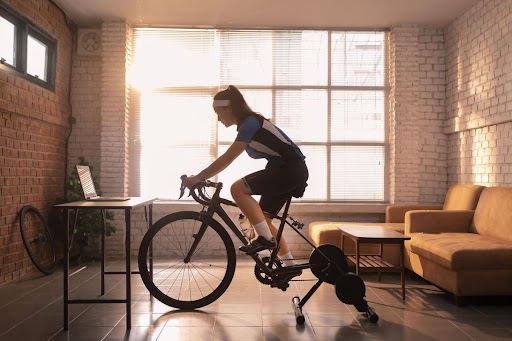 a girl doing indoor cycling